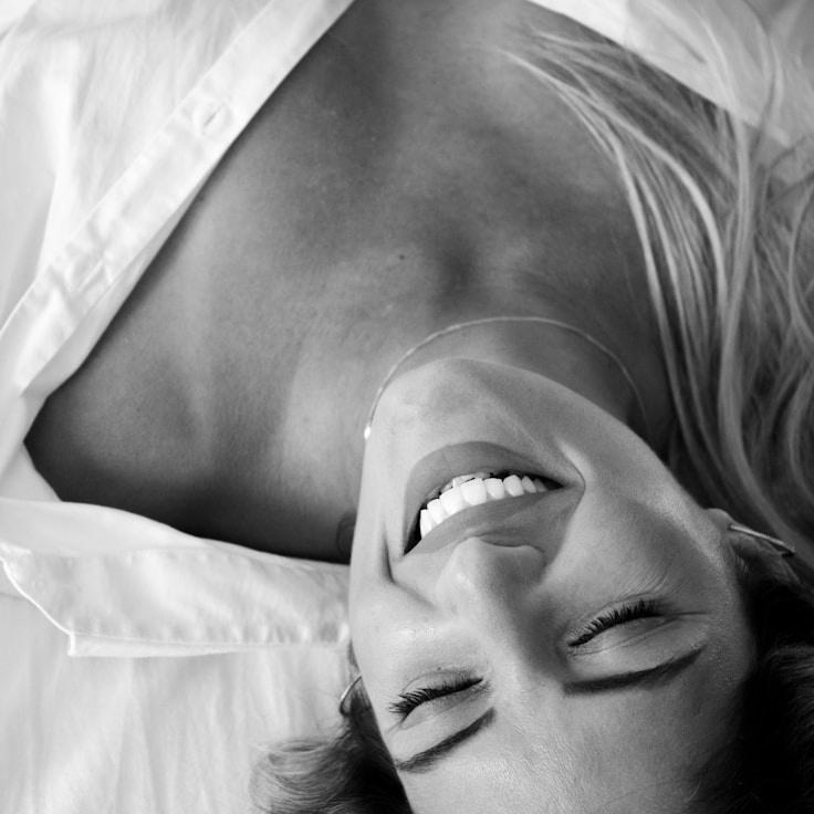 Kaveri Mehta, Lead Design Curator at Vista Atlas Studio, reviewing corporate floral arrangements